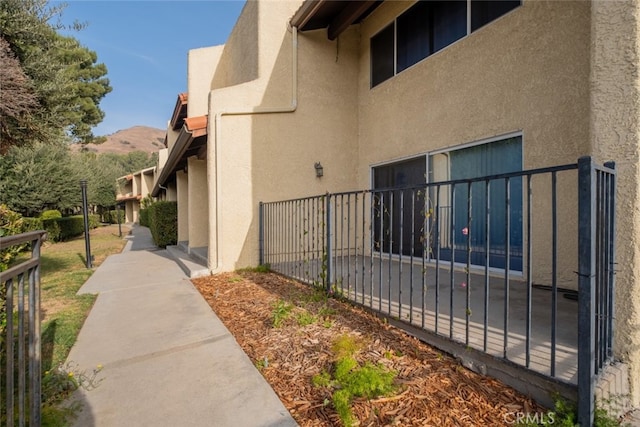 view of property exterior featuring a mountain view