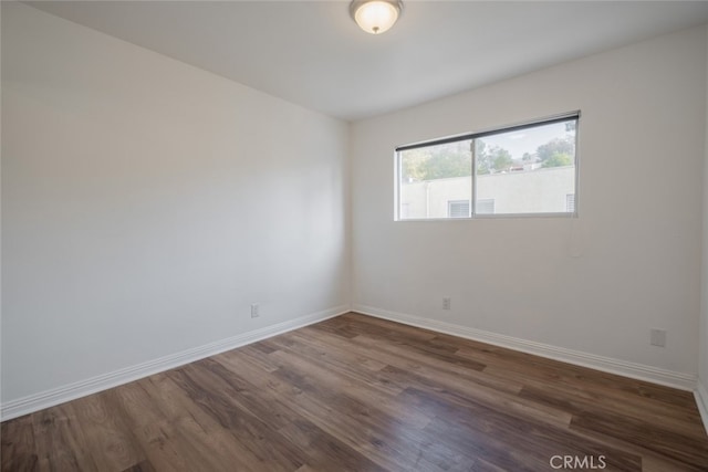 empty room featuring dark hardwood / wood-style floors