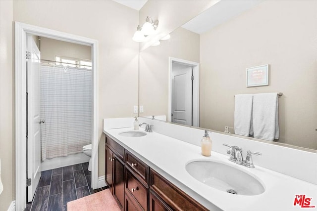 full bathroom with toilet, vanity, and shower / bath combination with curtain