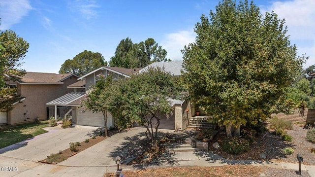 obstructed view of property with a garage