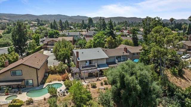 birds eye view of property with a mountain view