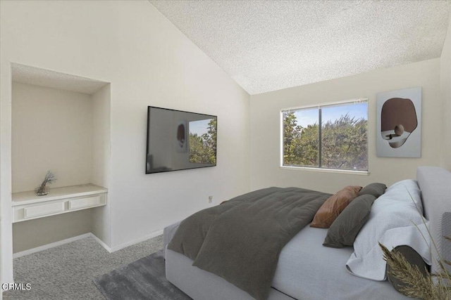 bedroom featuring a textured ceiling, lofted ceiling, and carpet floors