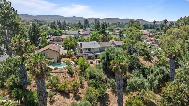 birds eye view of property with a mountain view