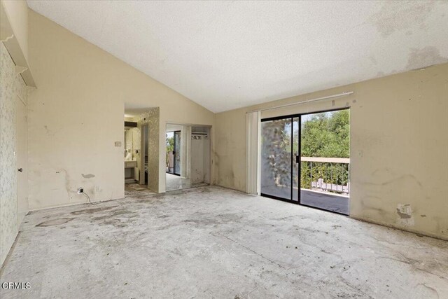 empty room with high vaulted ceiling