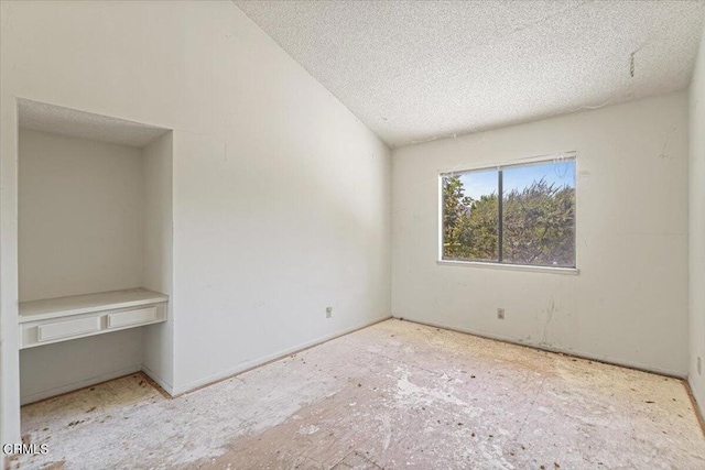 empty room with a textured ceiling