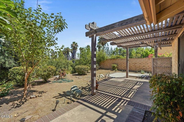 view of patio featuring a pergola