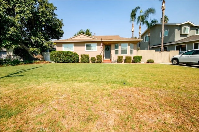 single story home with a front lawn