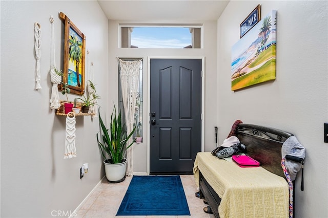 entryway featuring light tile patterned floors