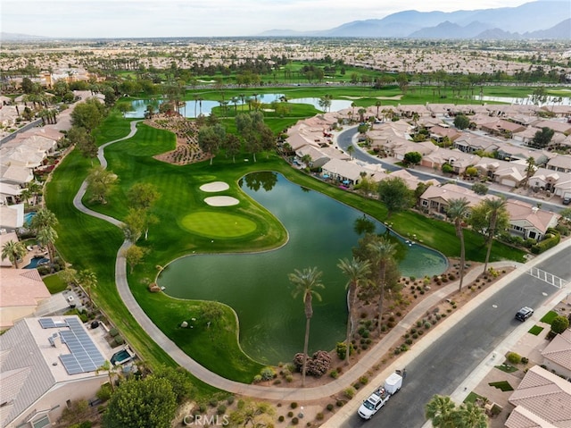 bird's eye view featuring a water and mountain view