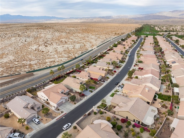 birds eye view of property featuring a mountain view