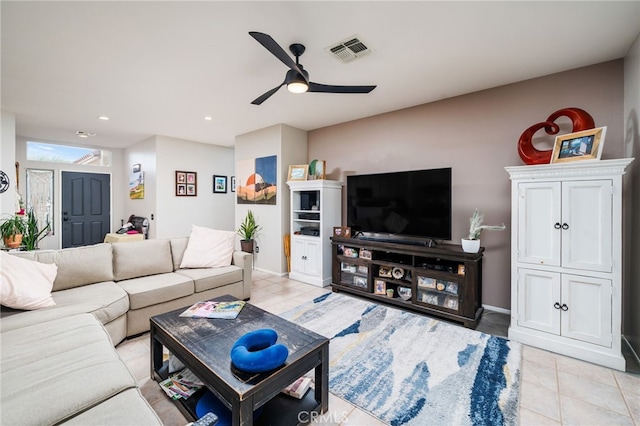 tiled living room featuring ceiling fan