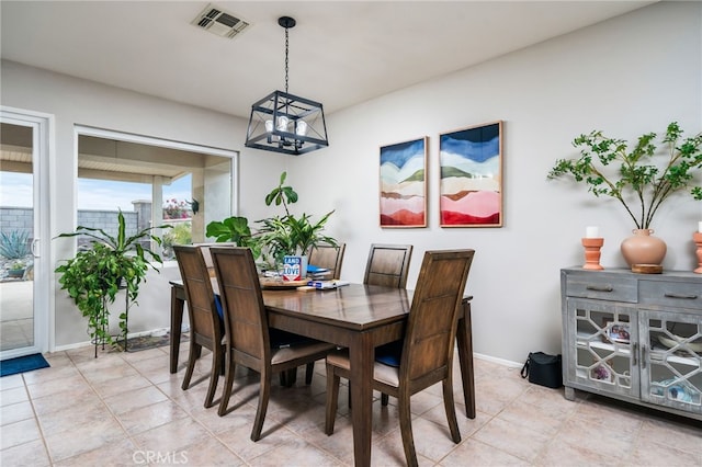 dining room featuring a chandelier