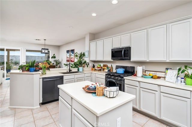 kitchen featuring a center island, dishwasher, sink, and stainless steel gas range