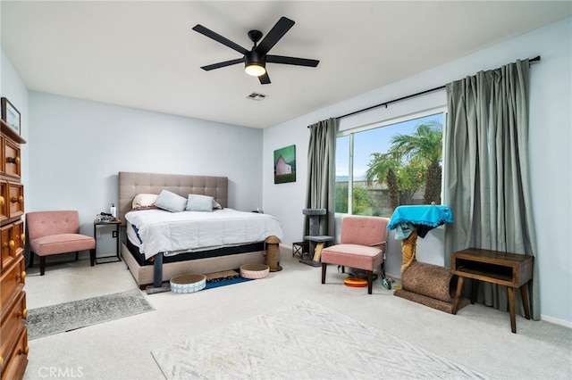 bedroom with light colored carpet and ceiling fan