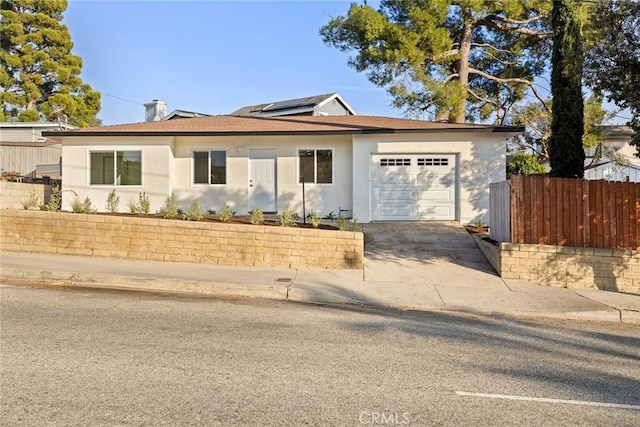 ranch-style house featuring a garage