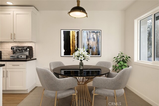 dining room featuring light hardwood / wood-style flooring and plenty of natural light