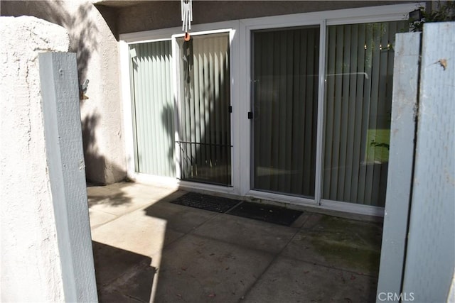 1718 Puente Ave Unit 40, Baldwin Park, CA 91706 - doorway to property featuring stucco siding and a patio area