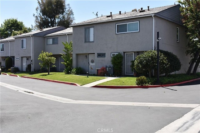 1718 Puente Ave Unit 40, Baldwin Park, CA 91706 - multi unit property featuring stucco siding and a front yard