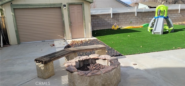 view of yard with a patio area and an outdoor fire pit