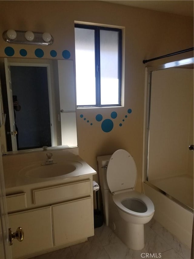full bath with vanity, combined bath / shower with glass door, toilet, and marble finish floor