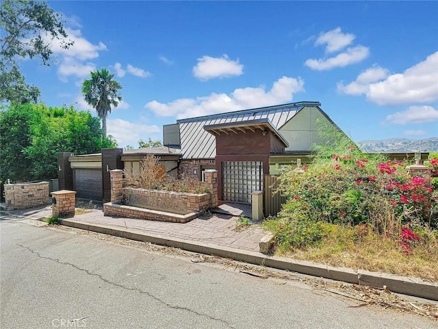 view of front of property with a mountain view