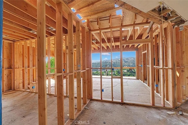 miscellaneous room with a mountain view