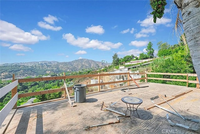 wooden terrace featuring a mountain view