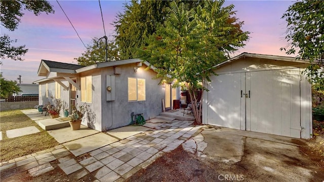 exterior space with a patio area and an outdoor structure