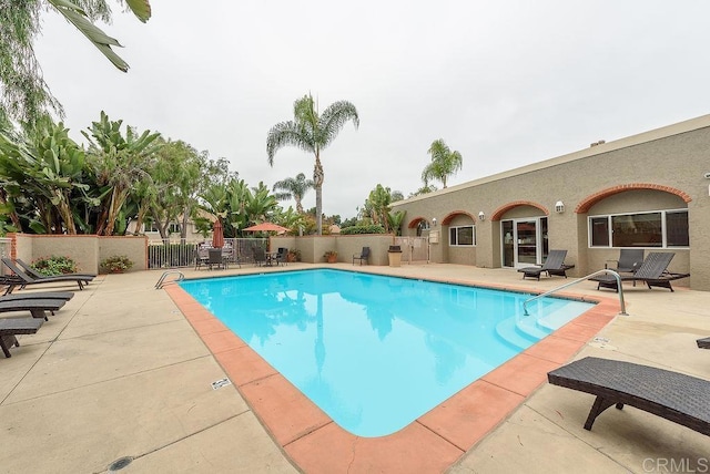 view of pool featuring a patio