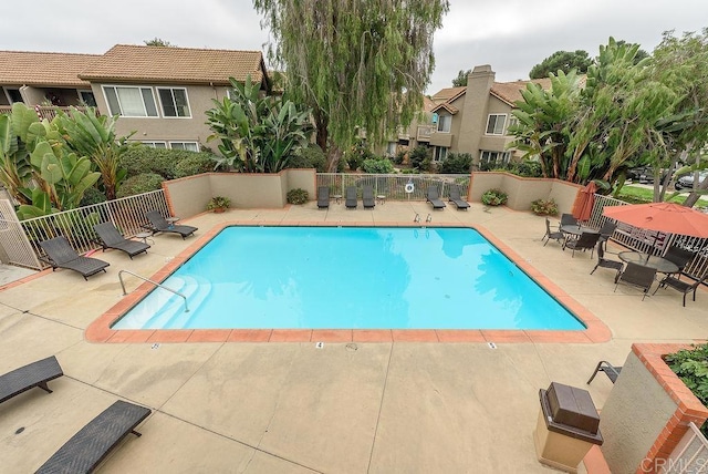 view of swimming pool featuring a patio