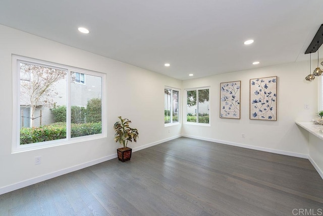 unfurnished room featuring dark hardwood / wood-style flooring