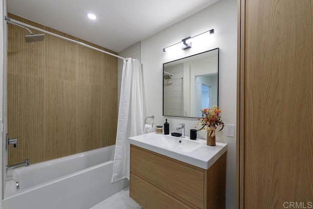 bathroom with shower / bath combo with shower curtain and vanity