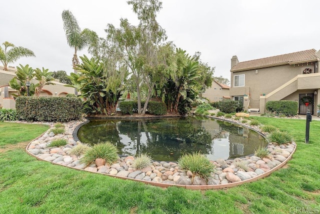 exterior space with a small pond