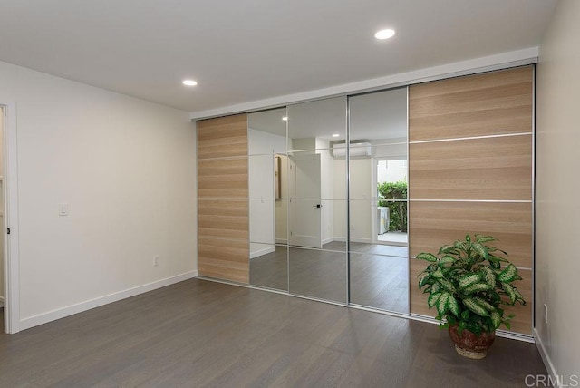 closet featuring a wall mounted air conditioner