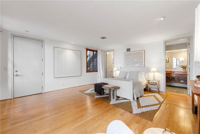 bedroom with light hardwood / wood-style floors