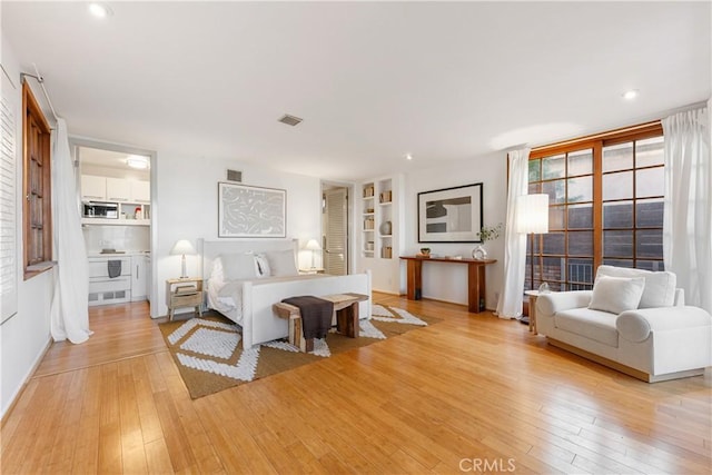 bedroom with light wood-type flooring