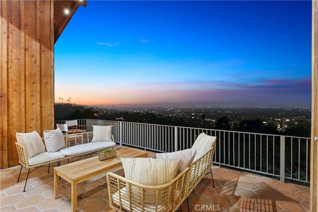 view of balcony at dusk