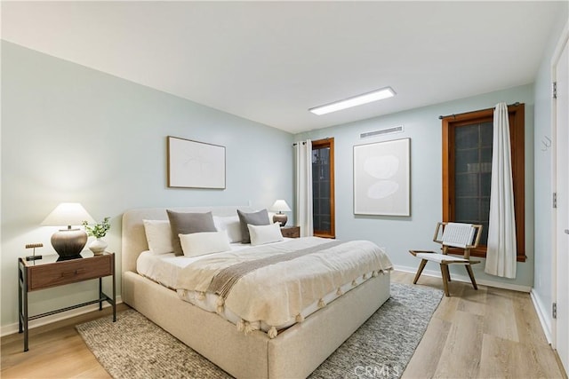 bedroom featuring light wood-type flooring