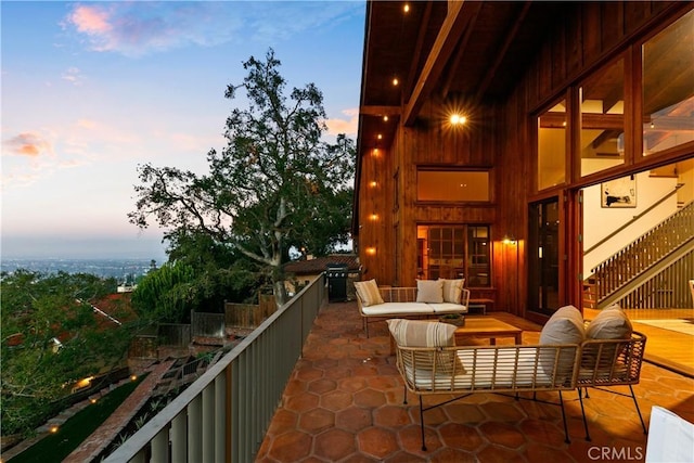 balcony at dusk with an outdoor living space