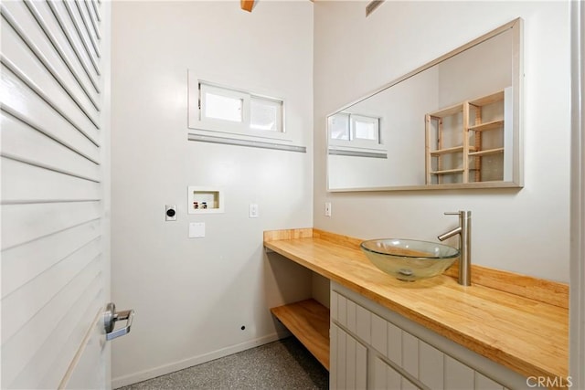 laundry room with hookup for a washing machine, sink, cabinets, and hookup for an electric dryer