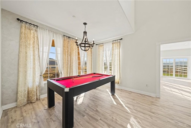 rec room featuring wood-type flooring, a notable chandelier, and pool table