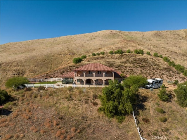 exterior space featuring a rural view and a mountain view