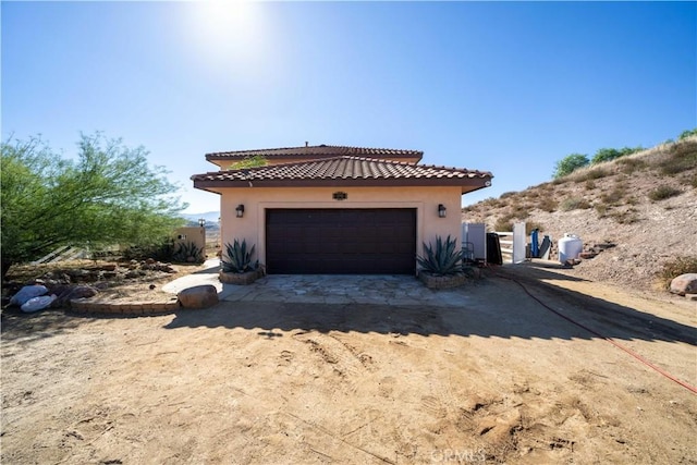 view of property exterior with a garage