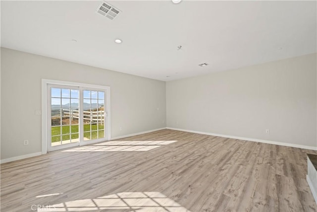 empty room with light wood-type flooring