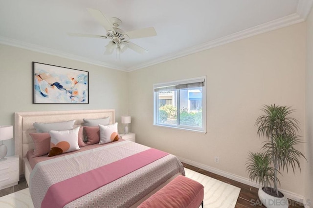 bedroom featuring ceiling fan, ornamental molding, and hardwood / wood-style flooring