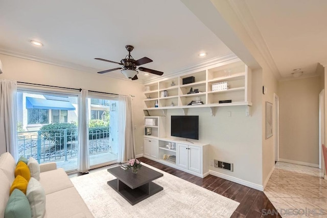 living room featuring ceiling fan and crown molding