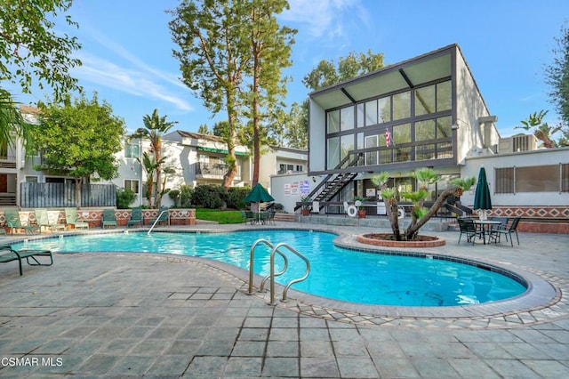 view of pool featuring a patio