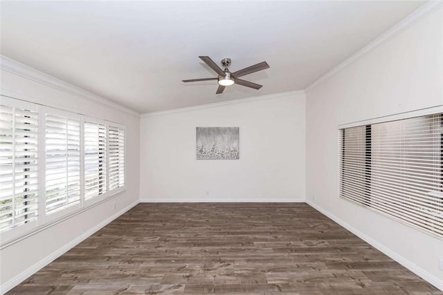 spare room featuring a ceiling fan, baseboards, ornamental molding, and wood finished floors