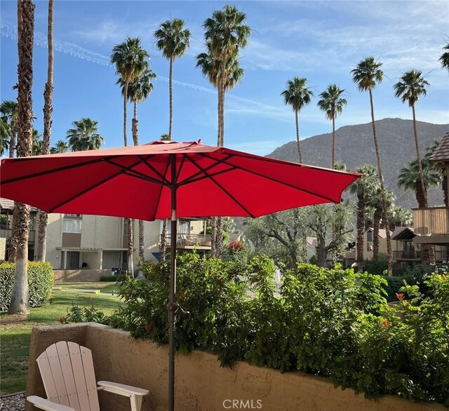 view of patio / terrace featuring a mountain view and a balcony