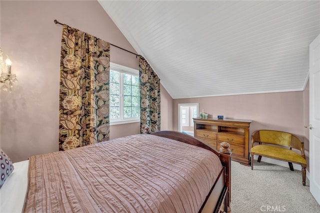 bedroom featuring lofted ceiling and carpet